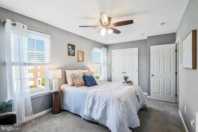 bedroom with baseboards, a closet, and carpet floors