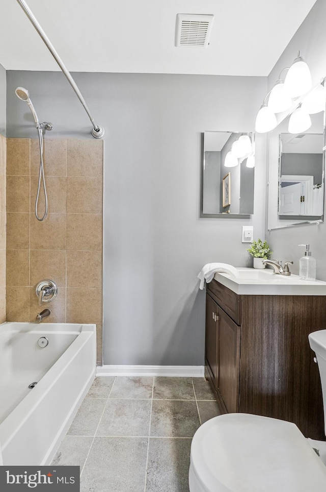 bathroom featuring vanity, baseboards, visible vents, tile patterned floors, and shower / bathtub combination