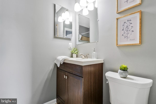 bathroom with toilet and vanity