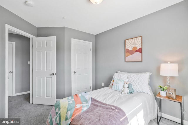 carpeted bedroom with baseboards