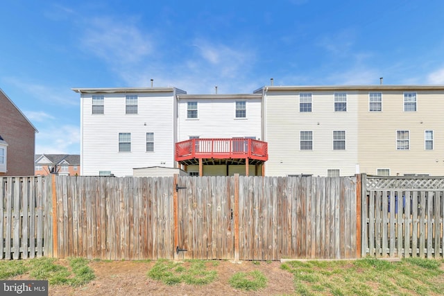 back of house featuring a fenced backyard