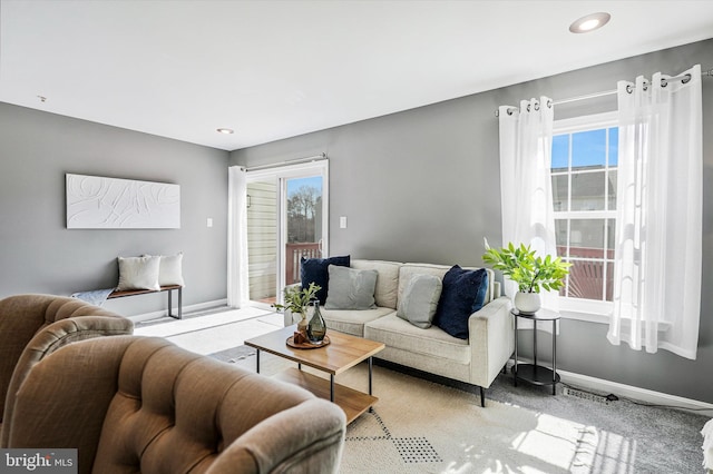 living area with plenty of natural light, recessed lighting, and baseboards