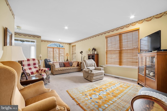 living room with recessed lighting, baseboards, visible vents, and carpet floors