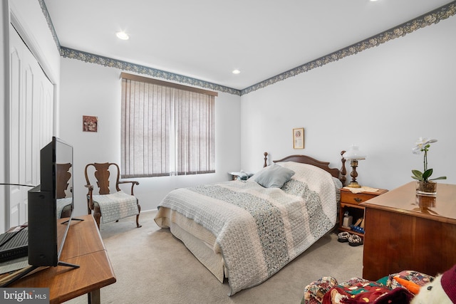 bedroom featuring recessed lighting, a closet, and carpet floors