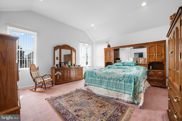 bedroom with lofted ceiling, recessed lighting, and light carpet