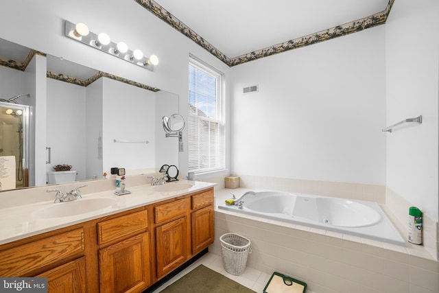 bathroom with a sink, visible vents, double vanity, and a shower stall