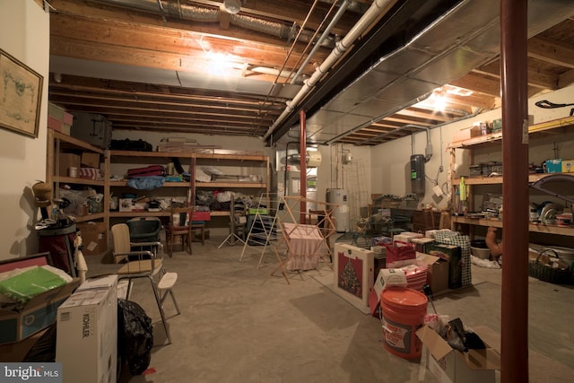 unfinished basement featuring water heater