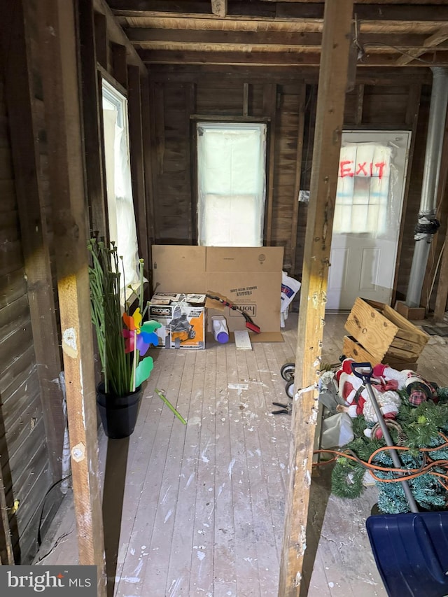 miscellaneous room featuring plenty of natural light and hardwood / wood-style flooring