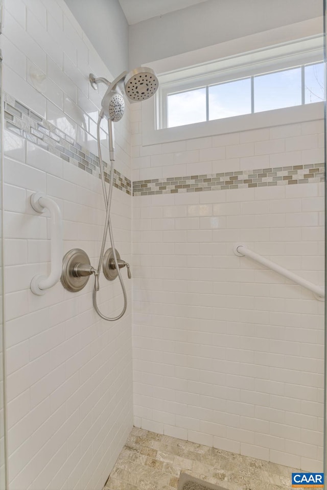 bathroom with tiled shower