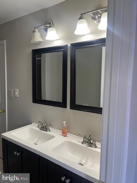 bathroom with double vanity and a sink