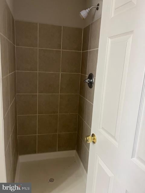 full bath with a shower stall