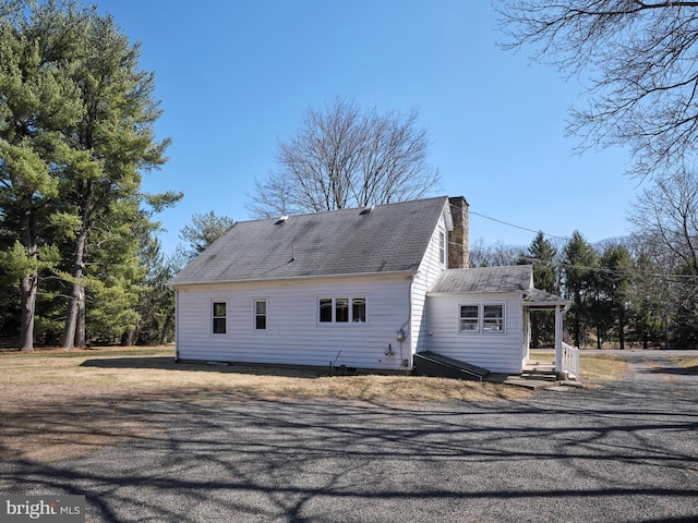 rear view of house with a chimney