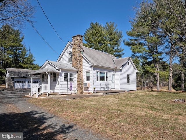 view of front of house featuring a chimney and a front lawn