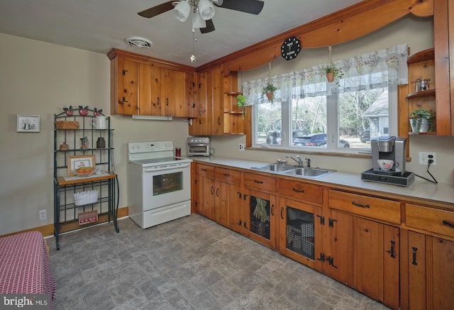 kitchen featuring visible vents, open shelves, a sink, light countertops, and electric stove