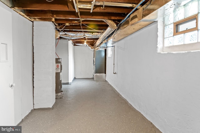 basement featuring heating unit and water heater