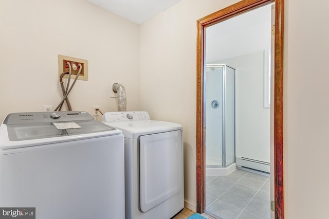 washroom with laundry area, light tile patterned floors, independent washer and dryer, and baseboard heating