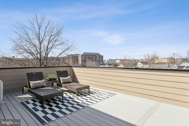 wooden terrace featuring a city view