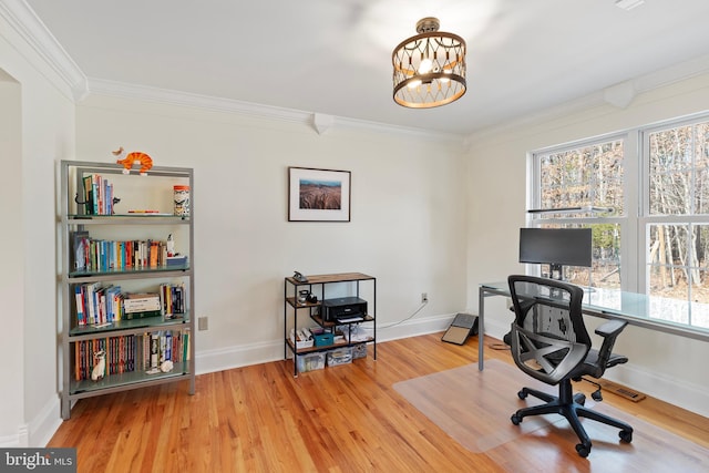 office space with crown molding, wood finished floors, baseboards, and a chandelier