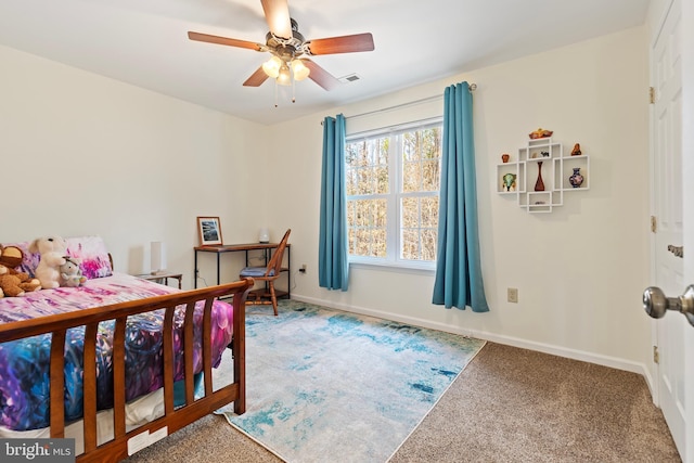 bedroom featuring visible vents, baseboards, carpet floors, and ceiling fan