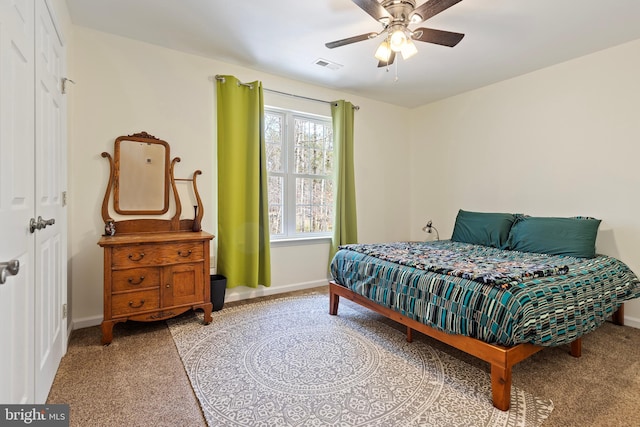 bedroom with light carpet, visible vents, ceiling fan, and baseboards