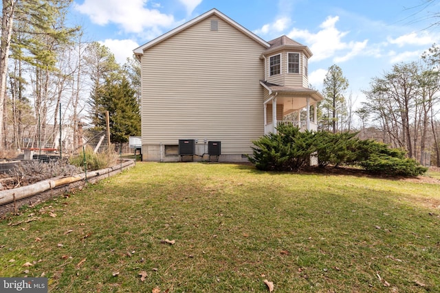 view of property exterior featuring crawl space and a lawn