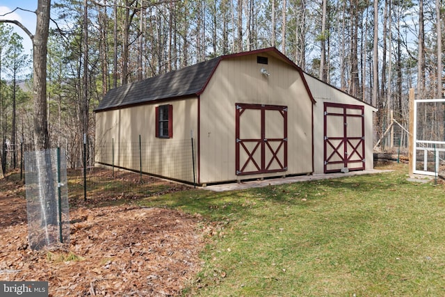 view of shed with fence