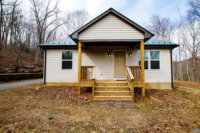 bungalow-style home with metal roof