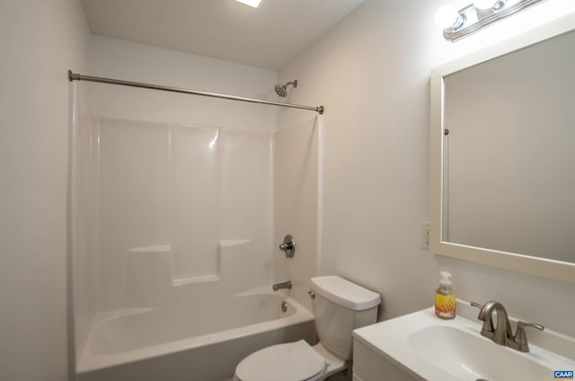 bathroom with toilet, vanity, and bathtub / shower combination