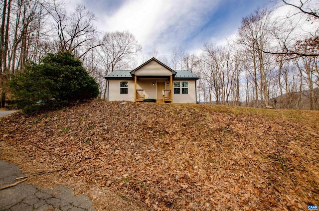 view of front of home with metal roof and covered porch