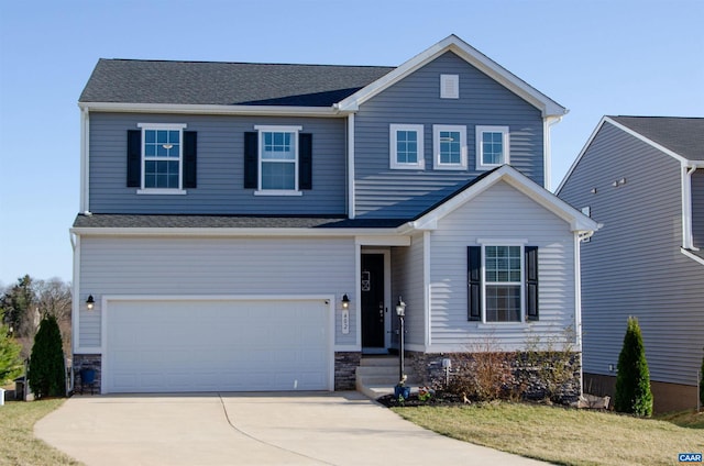 view of front of property featuring stone siding, an attached garage, and concrete driveway