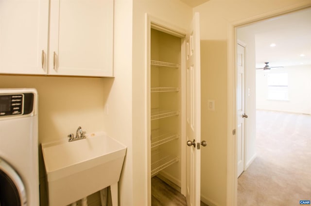 clothes washing area with light carpet, recessed lighting, ceiling fan, and a sink