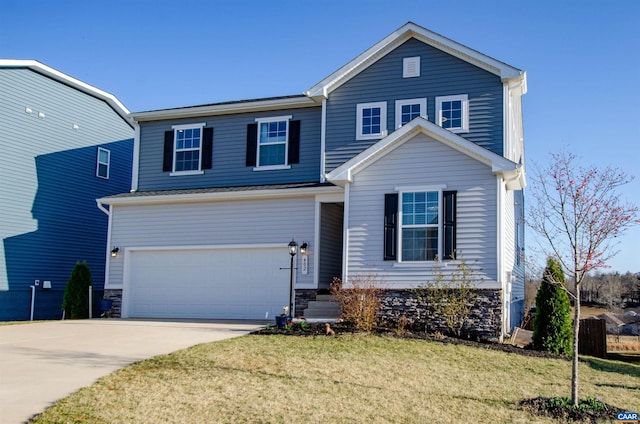 traditional-style house featuring an attached garage, concrete driveway, and a front lawn