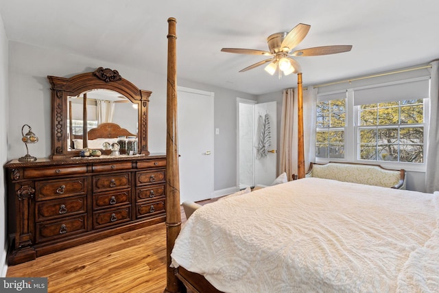 bedroom with ceiling fan and light wood-style flooring