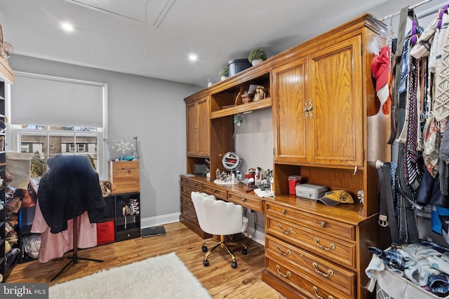 home office featuring recessed lighting, baseboards, attic access, and light wood finished floors