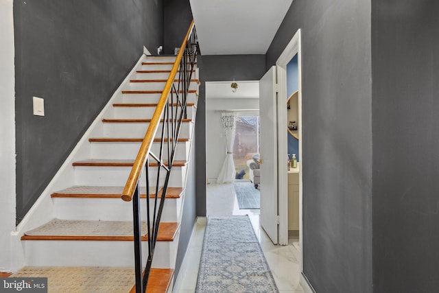 stairway with marble finish floor