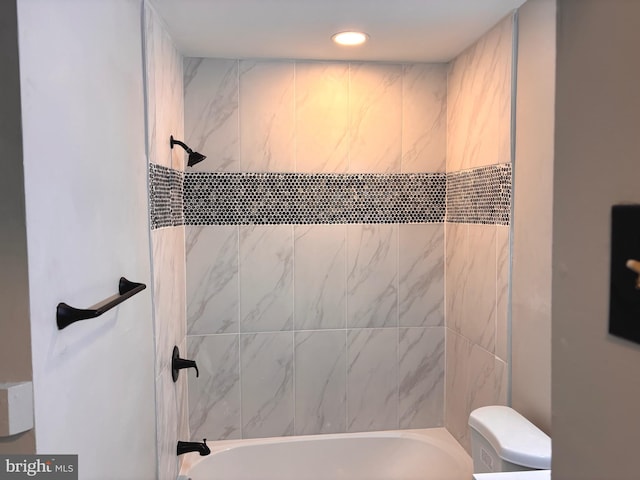 bathroom featuring recessed lighting, toilet, and  shower combination