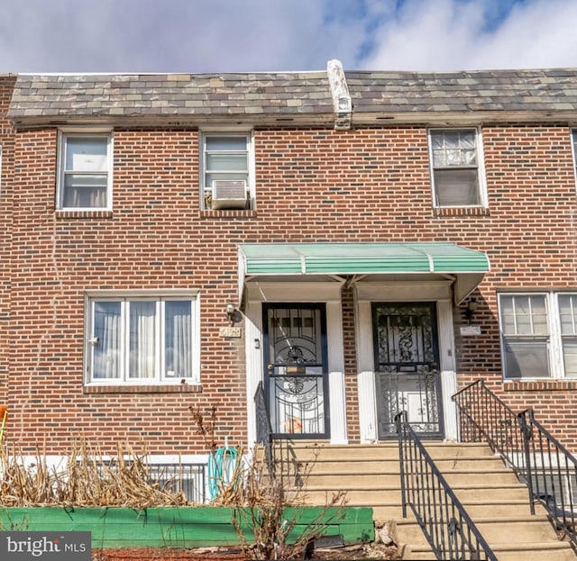 multi unit property with cooling unit and brick siding