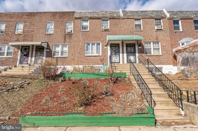 townhome / multi-family property with brick siding