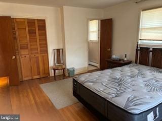 bedroom with wood finished floors