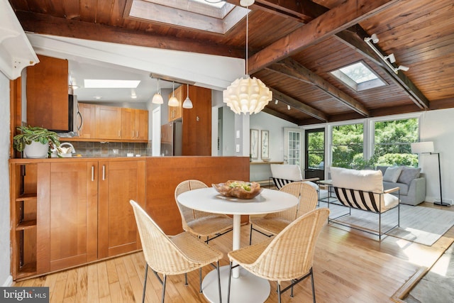 7711 Holmes Run Dr, Falls Church, VA 22042 - dining area with wood ceiling, lofted ceiling with skylight, and light wood finished floors