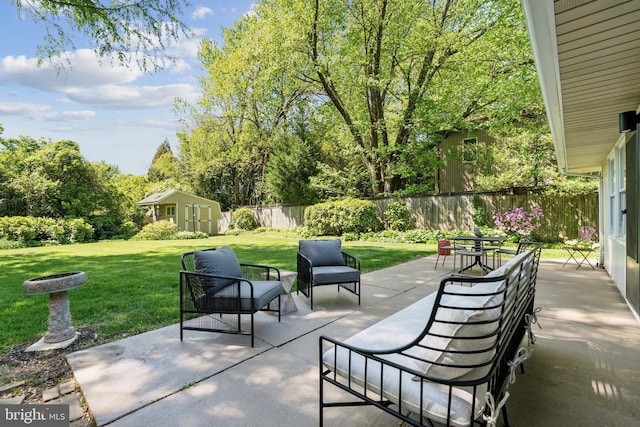 7711 Holmes Run Dr, Falls Church, VA 22042 - view of patio / terrace featuring a storage shed, an outbuilding, and a fenced backyard