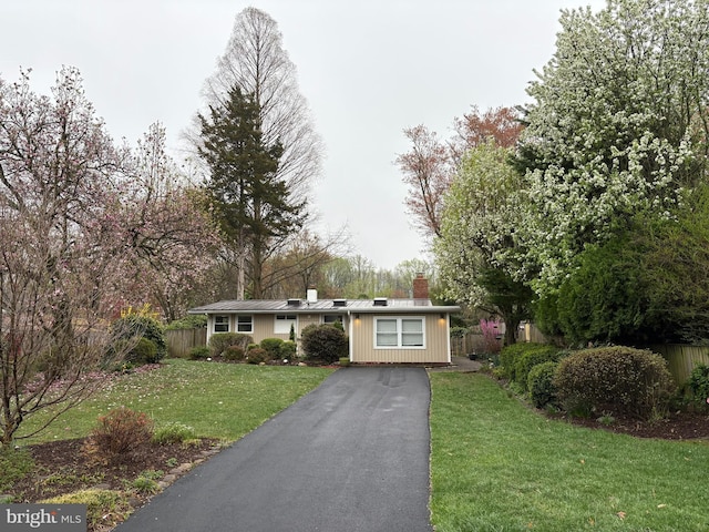 7711 Holmes Run Dr, Falls Church, VA 22042 - ranch-style house featuring fence, a chimney, driveway, and a front lawn