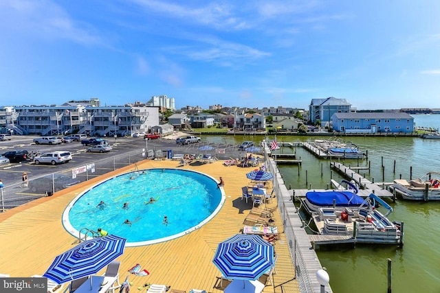 view of pool with a water view