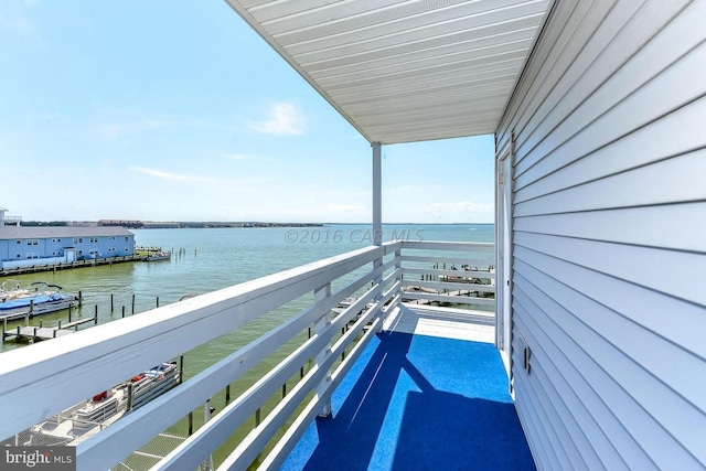 balcony featuring a water view