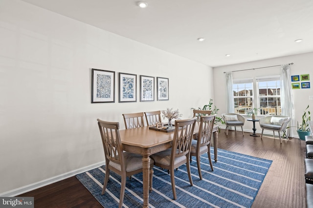 dining space featuring recessed lighting, baseboards, and wood finished floors