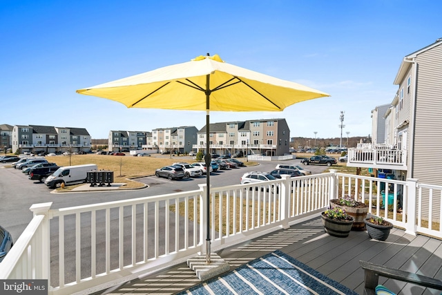 wooden deck featuring a residential view