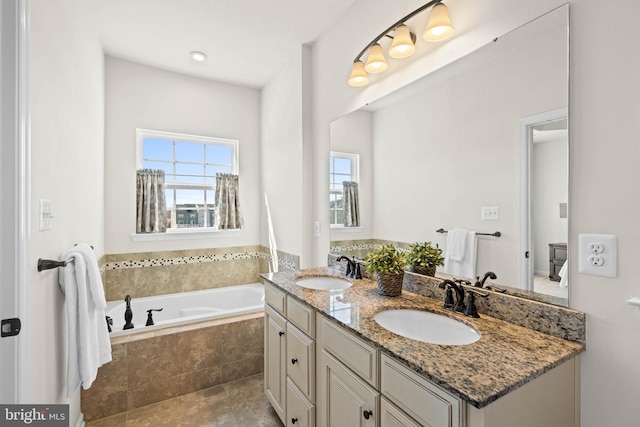 bathroom with a sink, a garden tub, and double vanity