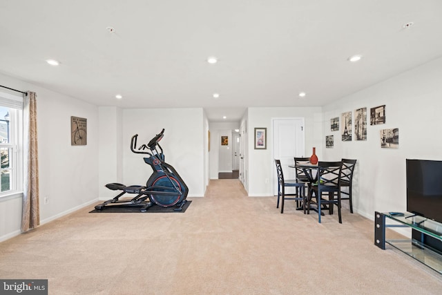 workout room with recessed lighting, baseboards, and light carpet