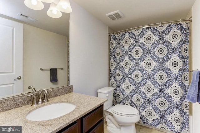 full bath with vanity, toilet, visible vents, and tile patterned flooring