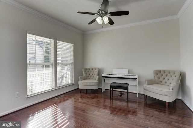 living area featuring wood finished floors and crown molding